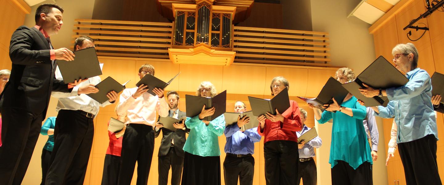 a photograph of a group of vocal performers on the Schroeder Hall stage in the Green Music Center