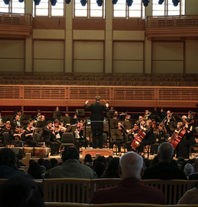 Orchestra performing on Weill Hall stage
