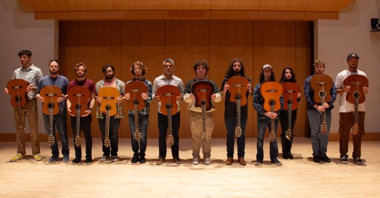 Guitar Ensemble standing in a line