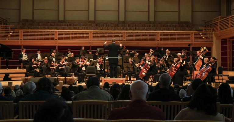 Orchestra performing on Weill Hall stage