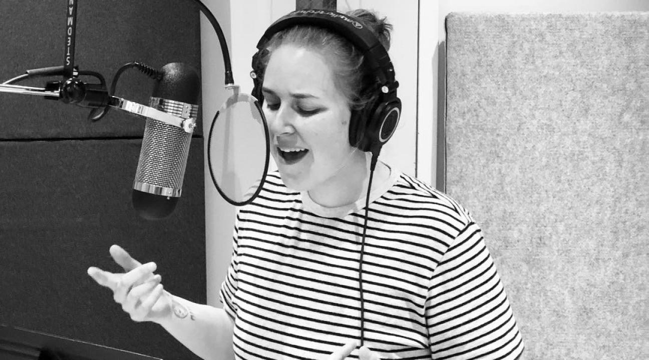 Alison Poteracke singing in a booth