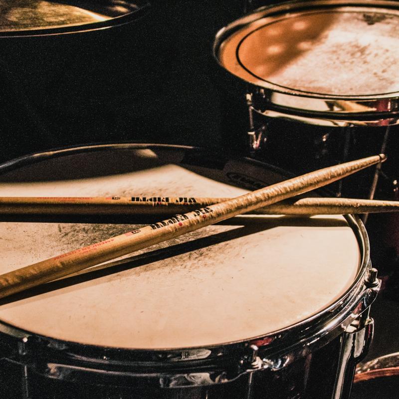 Drumsticks resting on drum