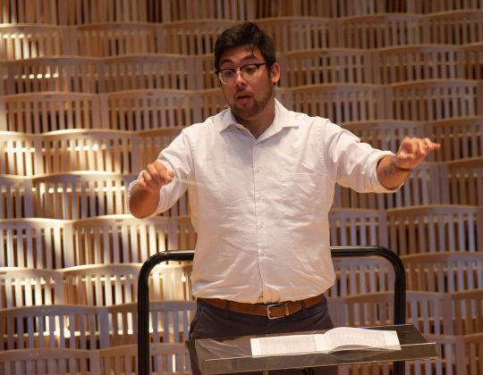 A man conducting a rehersal