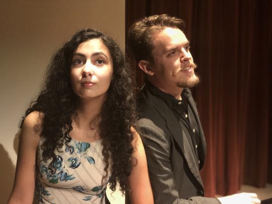 Man and Woman singing together for a play