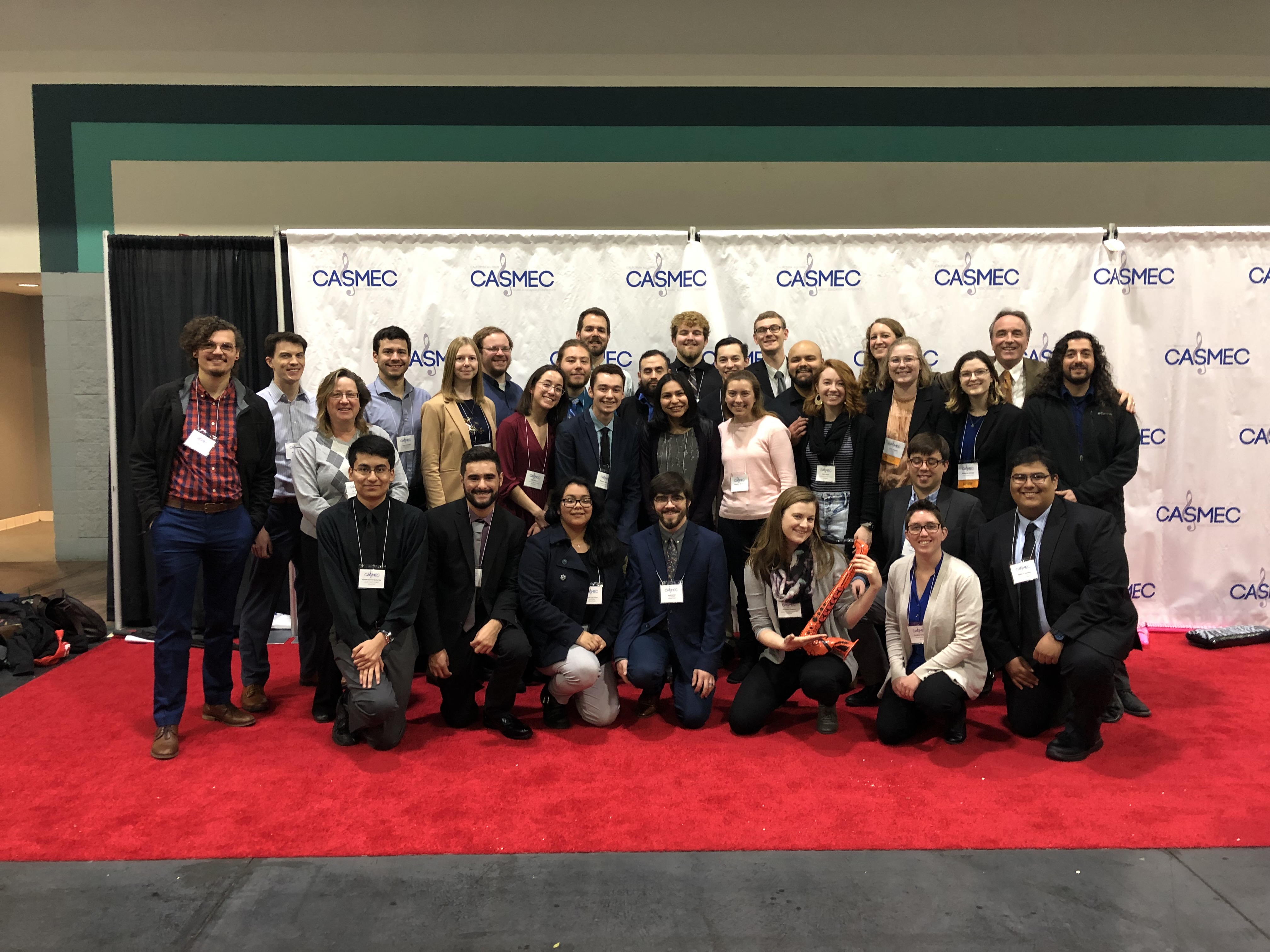 Group Picture of students in front of banner at CASMEC