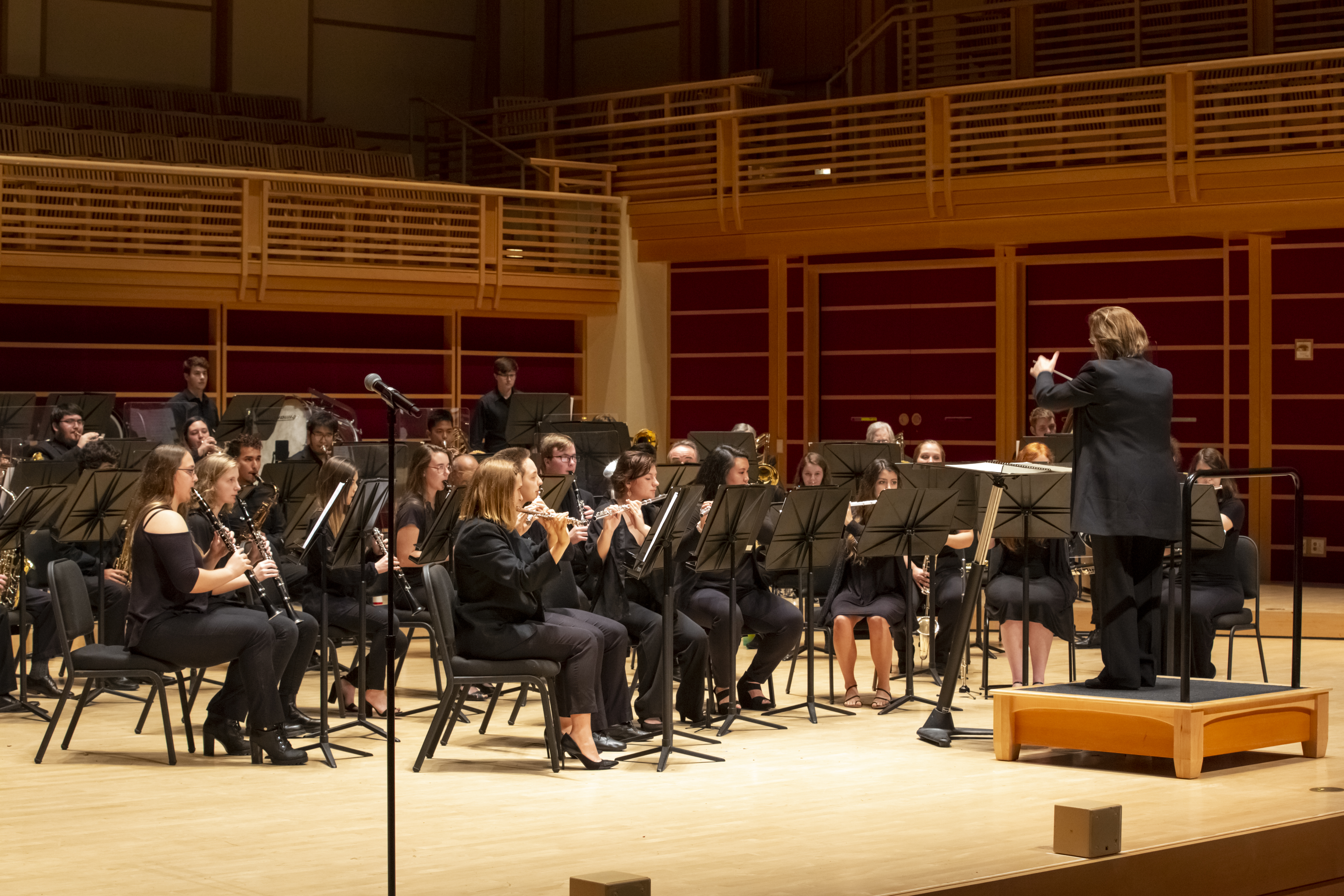 Dr. Mieder conducting the concert band on weill hall stage