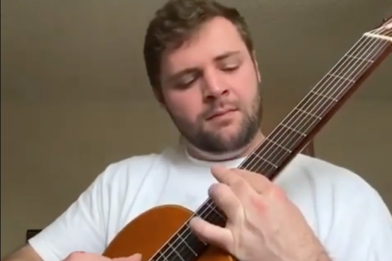 Student playing guitar