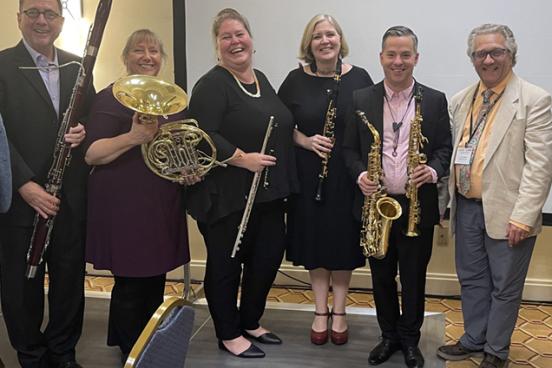 Pictured: FSU Faculty Winds Jeff Keeseker, bassoon; Michelle Stebleton, horn; Karen Large, flute; Deborah Bish, clarinet; and Geoffrey Diebel, saxophone with Brian Wilson Group of musicians standing for a group picture