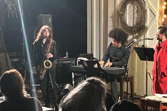 Estella and Jomei performing in front of a crowd