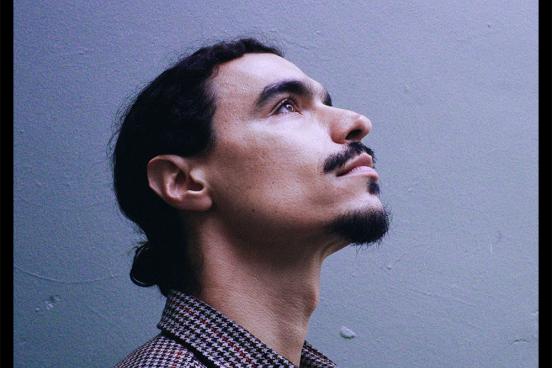 Raffi Garabedian looking profile upwards on an album cover