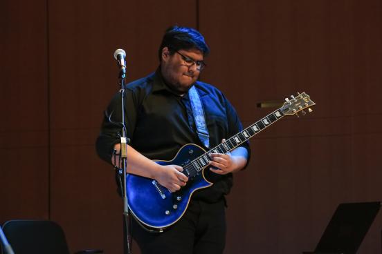 Mateo playing guitar