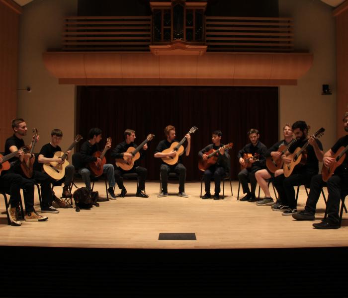 Guitar Ensemble playing on stage