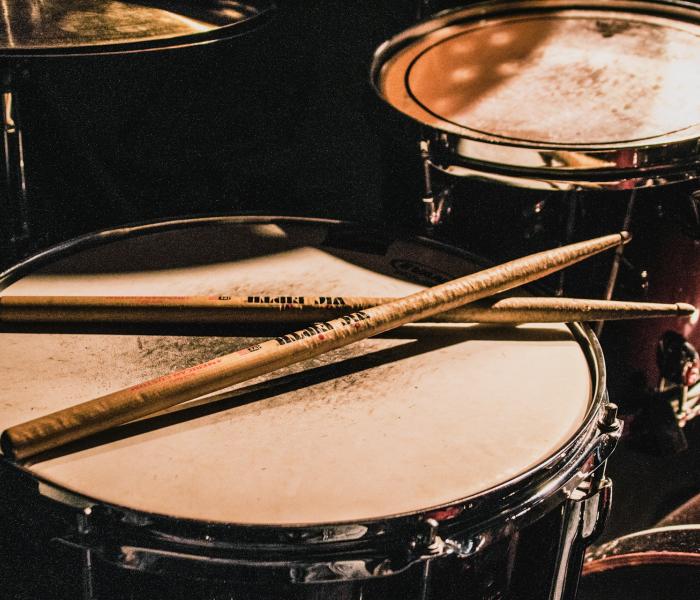 Drumsticks resting on drum