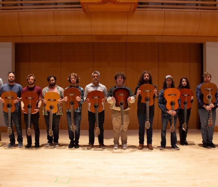 Guitar Ensemble standing in a line