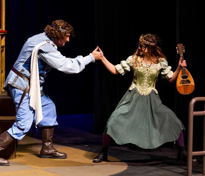 Scene from Once Upon a Matttress with characters playing a thumb war