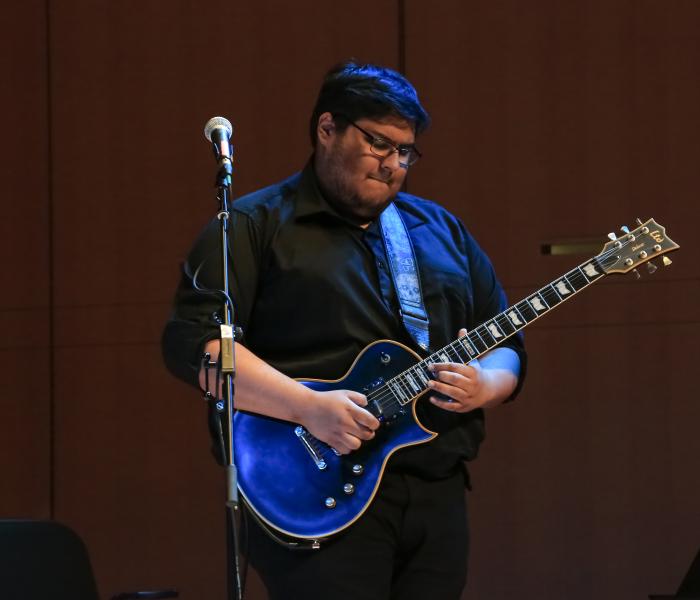 Mateo playing guitar