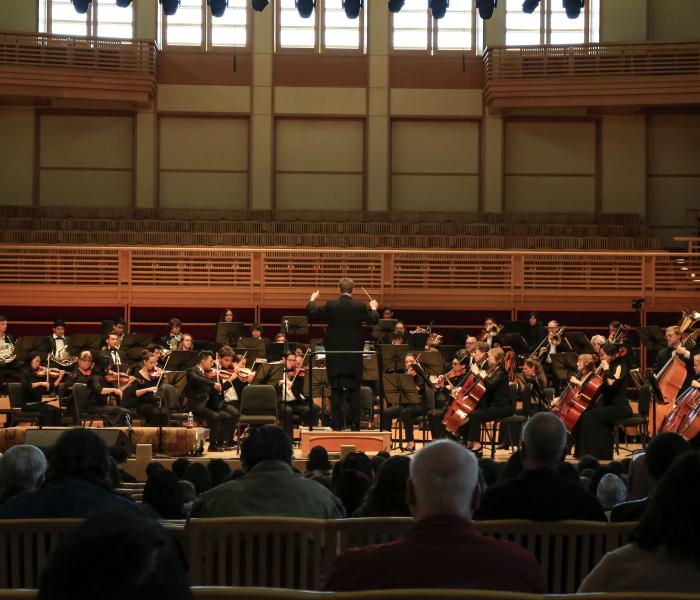 Orchestra performing on Weill Hall stage