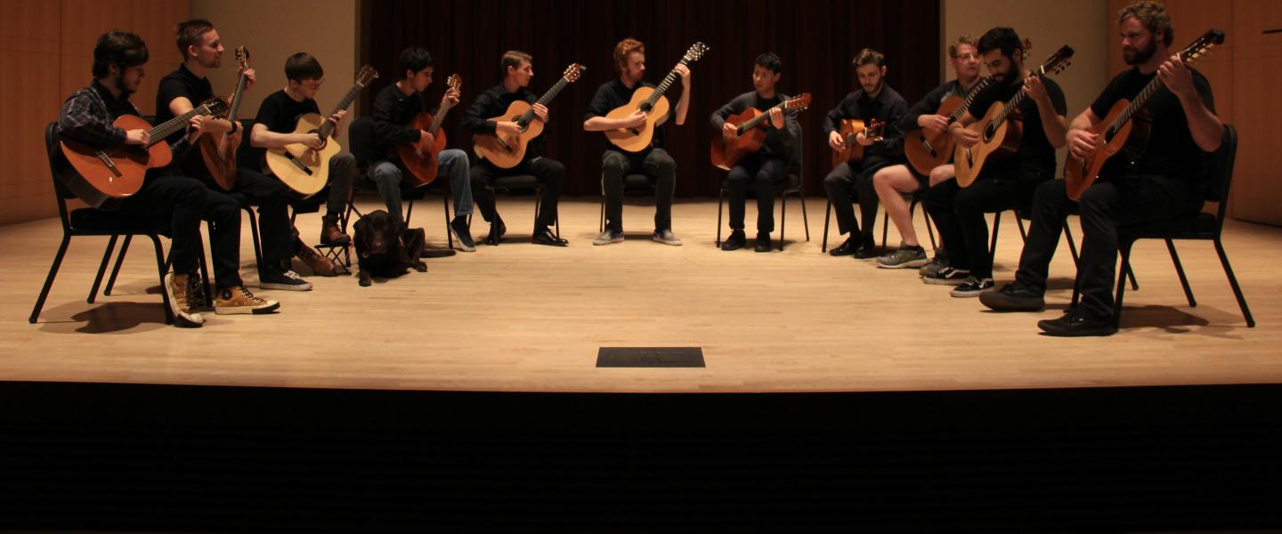 Guitar Ensemble playing on stage in Schroeder Hall