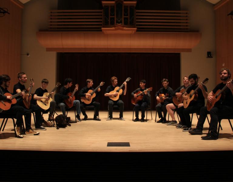 Guitar Ensemble playing on stage