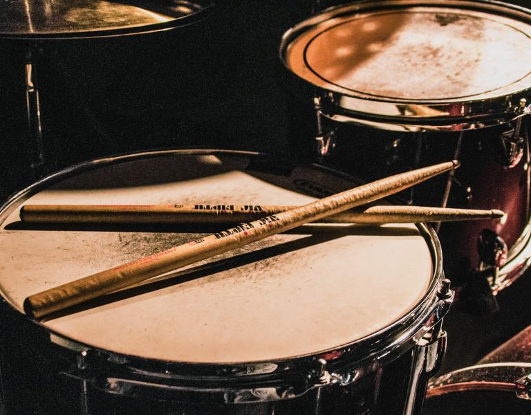 Drumsticks resting on drum