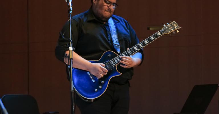 Mateo playing guitar