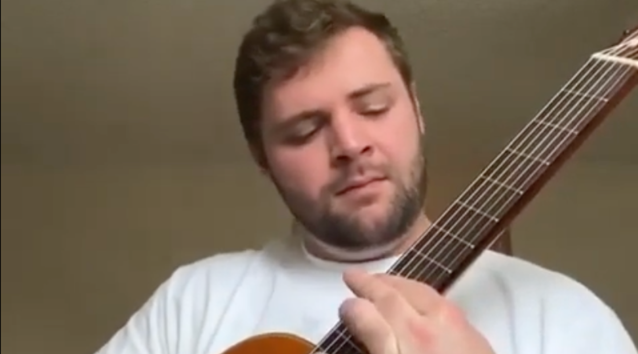 Student playing guitar