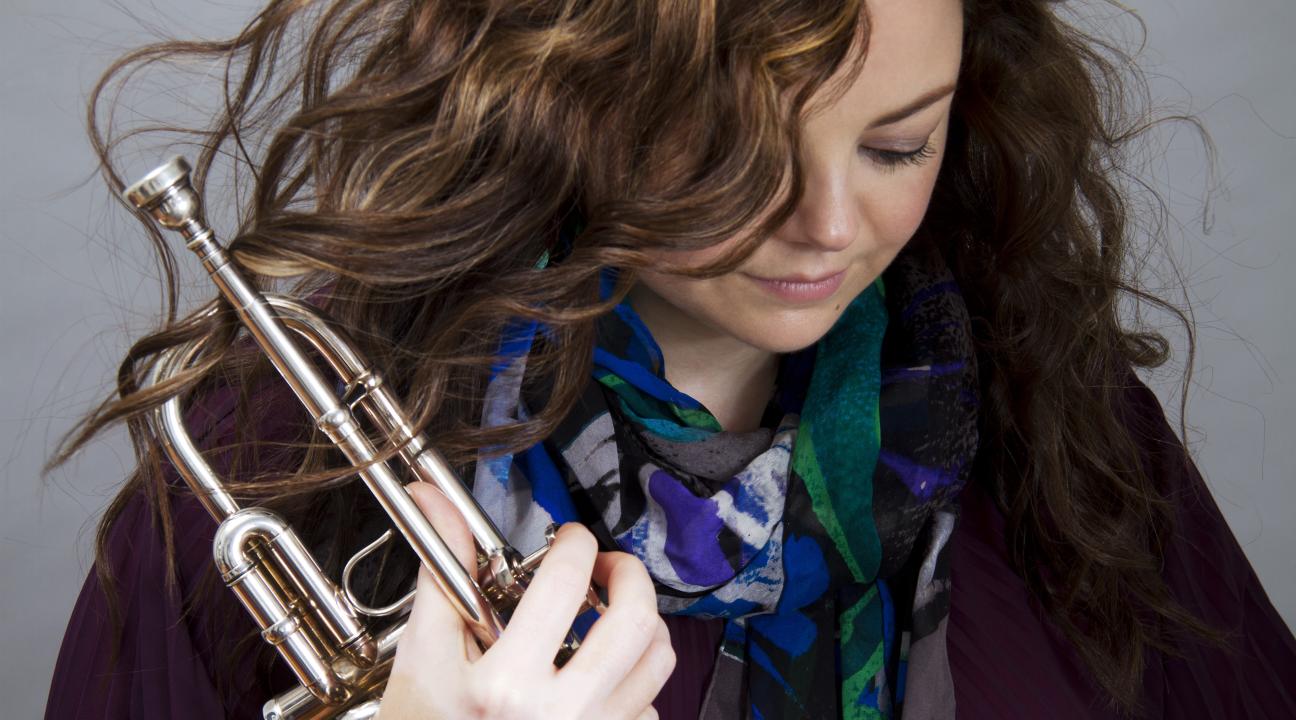 Nadje Noordhuis headshot with trumpet