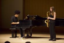 Saxophonist and pianist performing on Schroeder stage