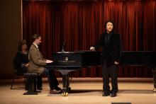Singer on stage with pianist
