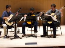 three classical guitarists