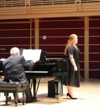 Singer on stage with pianist