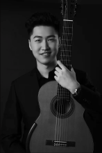 Tengyue Zhang (TY) Headshot with guitar