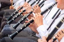 people playing clarinets all in a row