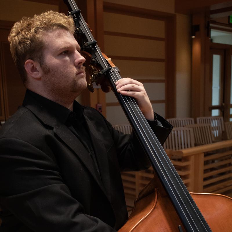 Student playing Bass