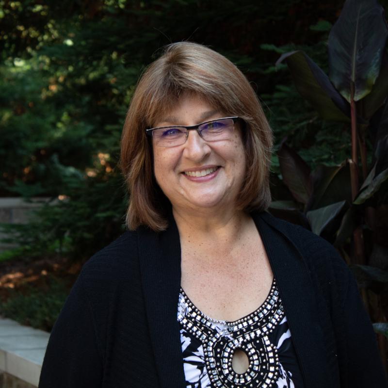 Yvonne wormer Headshot outside of Schroeder