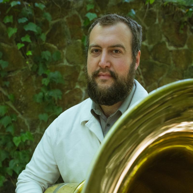 Jonathan Seiberlich Headshot holding a tuba