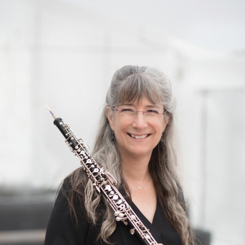 Laura Reynolds Headshot holding Oboe