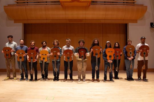 Guitar Ensemble standing in a line