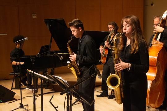 Concert Jazz Ensemble reherasing on stage