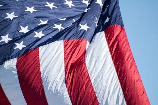 United States flag blowing in the wind