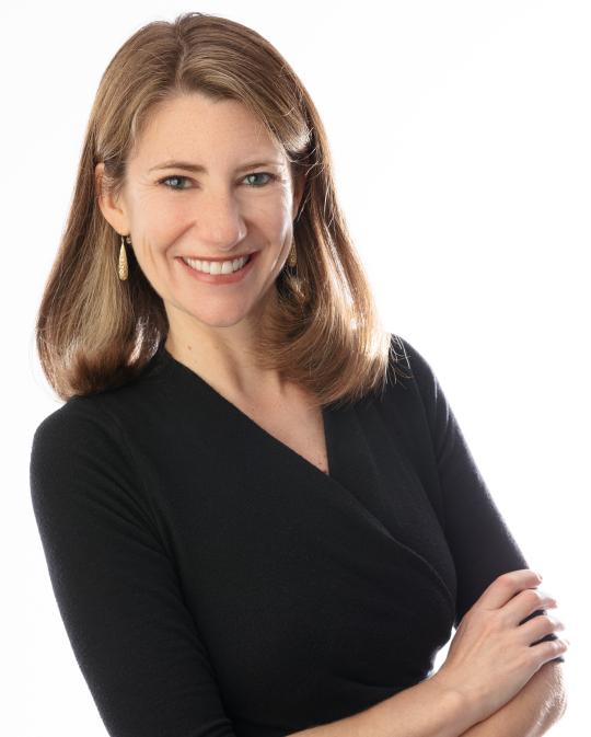 Jenny Bent Headshot with white background and arms folded