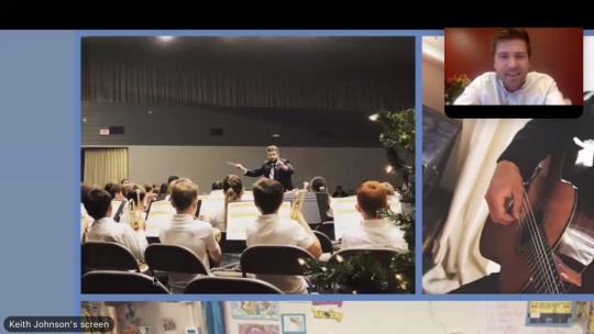 Screenshot of Cody Martin conducting student orchestra