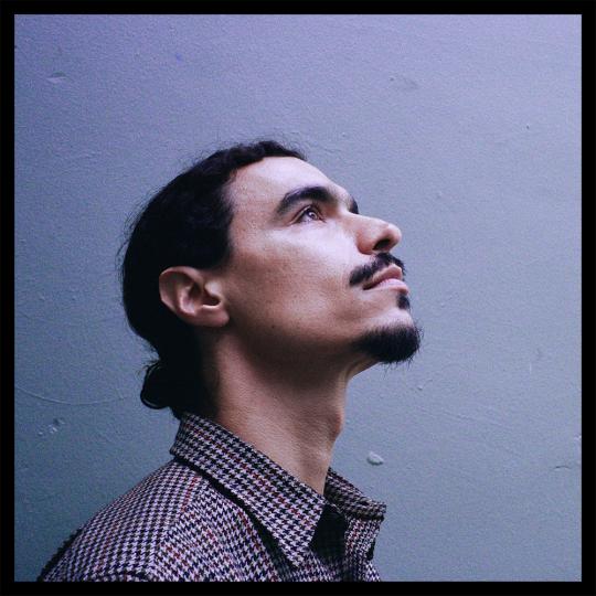 Raffi Garabedian looking profile upwards on an album cover