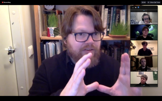 Alex Freeman talking to students using his hands 