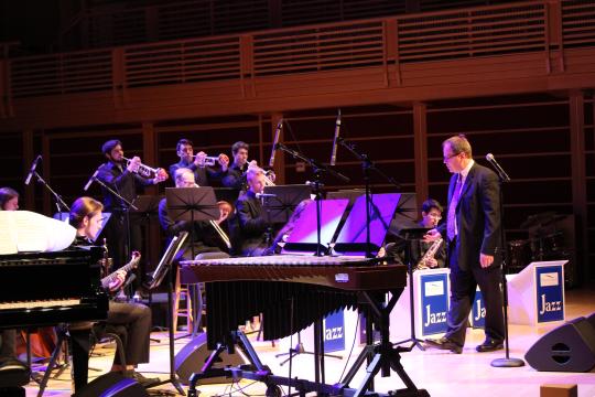 Director and conductor Doug Liebinger snaps off a quick count during their performance in May of 2019