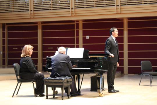 A pianist accompanies a talented male vocalist on stage at Weill Hall in the Green Music Center