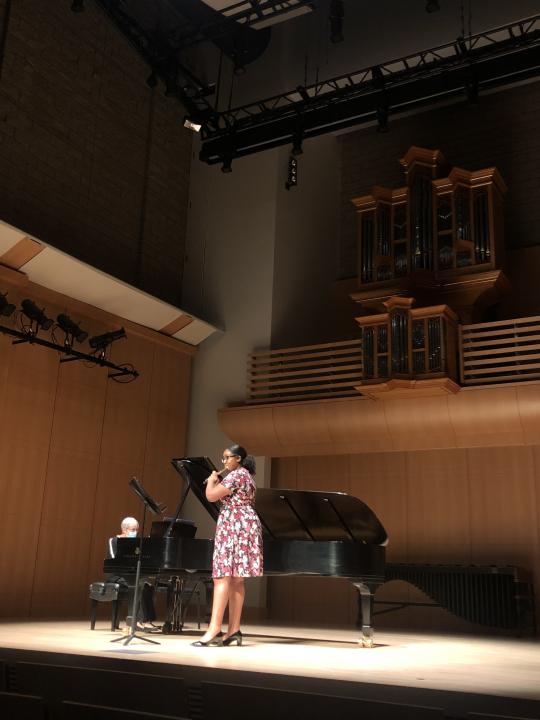 Flautist and pianist on stage of Schroeder Hall