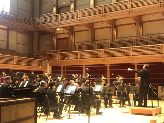 Director Andy Collinsworth, right, conducts the Sonoma State University Symphonic Wind Ensemble for the CMEA competition.