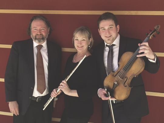 Three instrumentalists, one holding a flute and one holding a viola