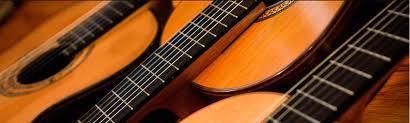 Close up on some acoustic guitars